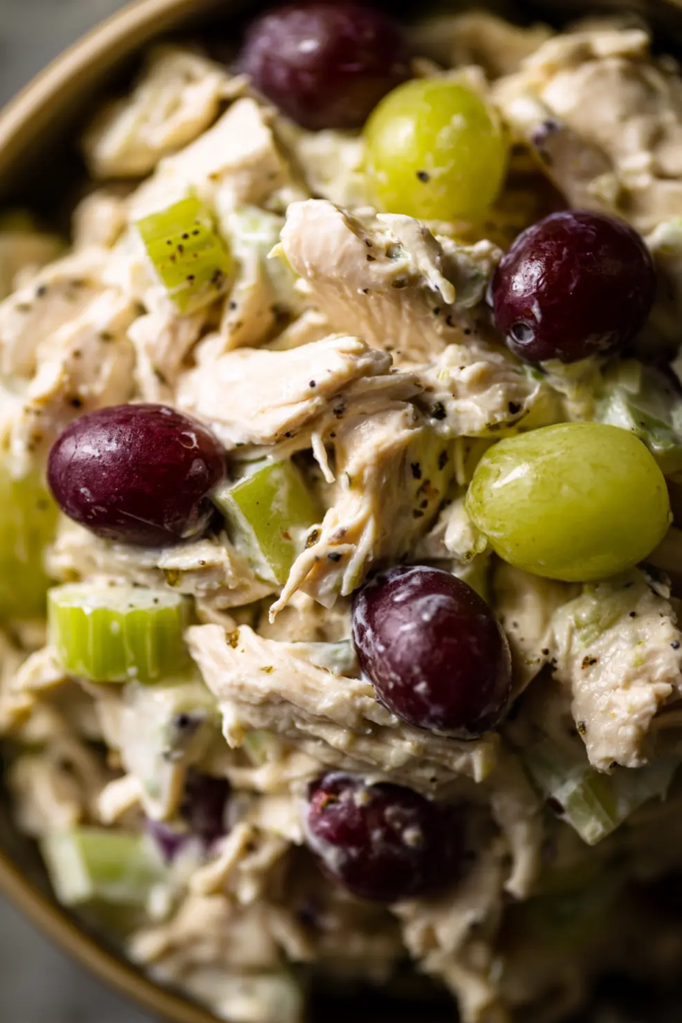 Basic chicken salad recipe being served on a croissant with lettuce leaf as a sandwich