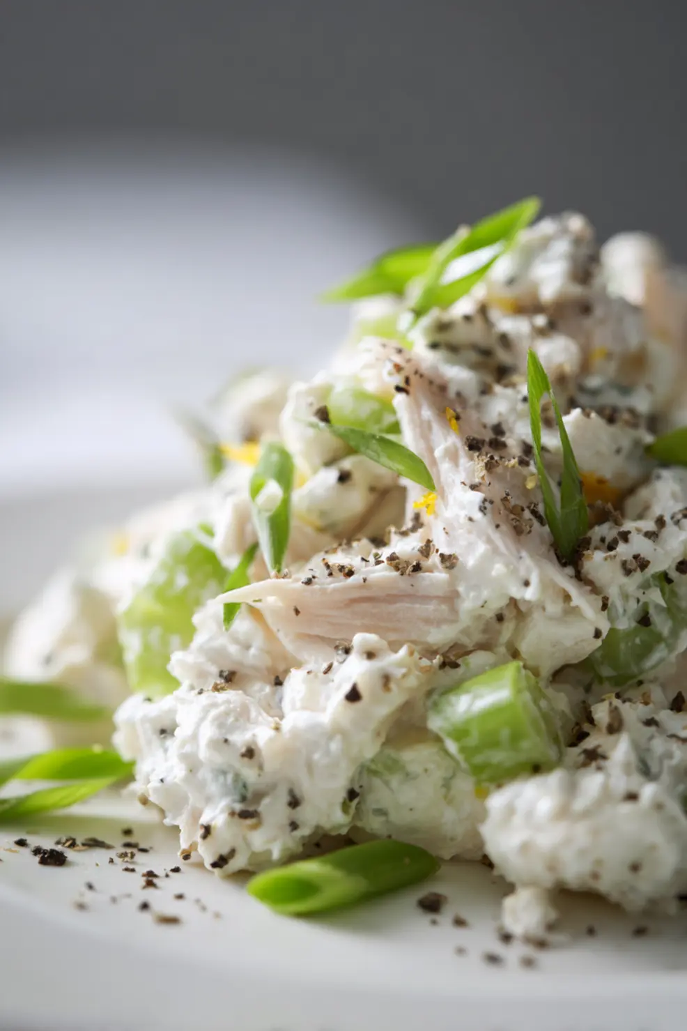 Meal prep containers with cottage cheese chicken salad and fresh vegetables