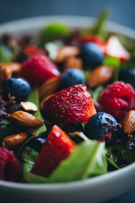 Beautifully presented berry salad in a white serving bowl