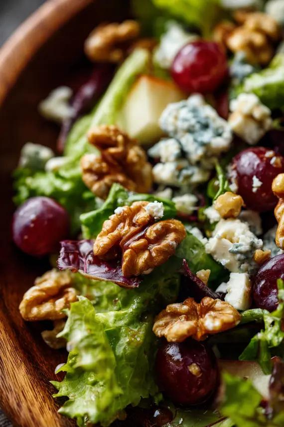 Completed blue cheese salad served in a white bowl with a fork