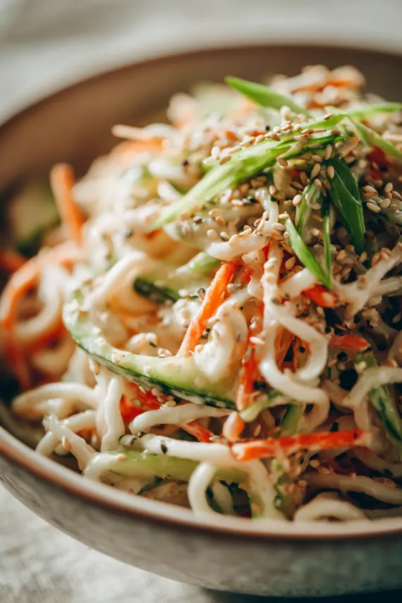 Closeup of creamy noodle salad with mayonnaise in a bowl